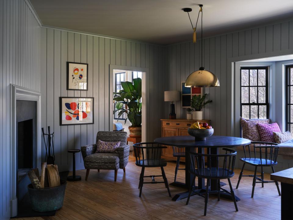 In the eat-in kitchen, table and chairs by O&G studio beneath a vintage pendant from 1stdibs; the Alexander Calder artworks were found at an estate sale.