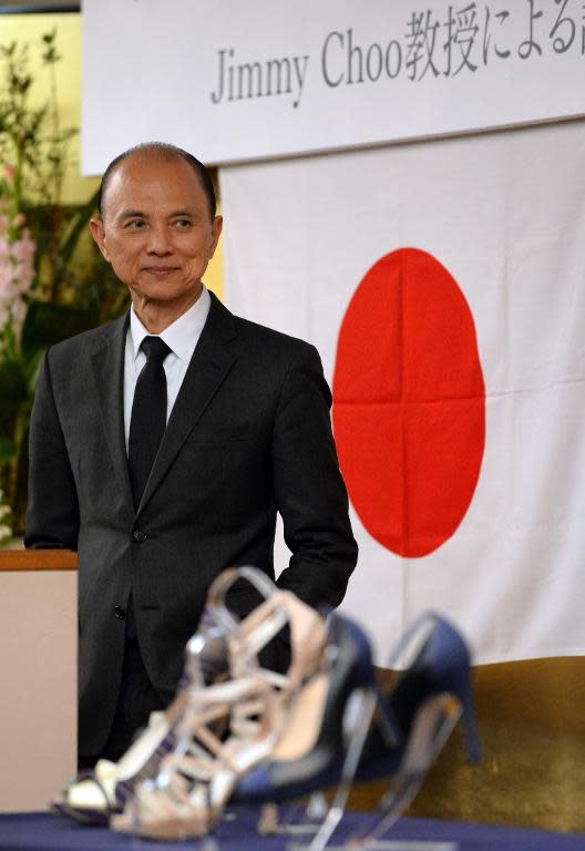 Jimmy Choo listens to a question during his lecture "Creativity Through Skills" in Fukushima city on April 18, 2014