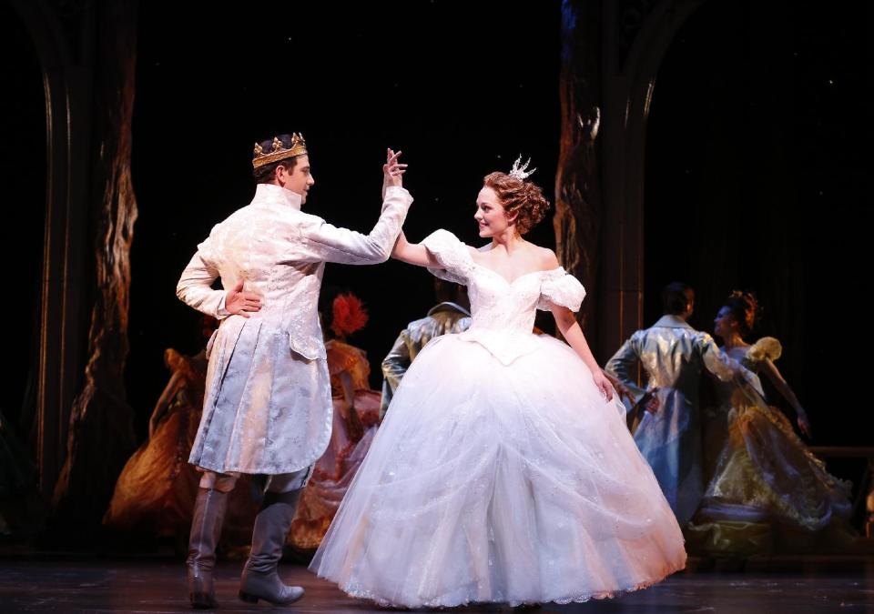 This theater image released by Sam Rudy Media Relations shows Laura Osnes as Cinderella, right, dancing with Santino Fontana as the Prince, during a performance of "Rodgers + Hammerstein's Cinderella on Broadway." (AP Photo/Sam Rudy Media Relations, Carol Rosegg)