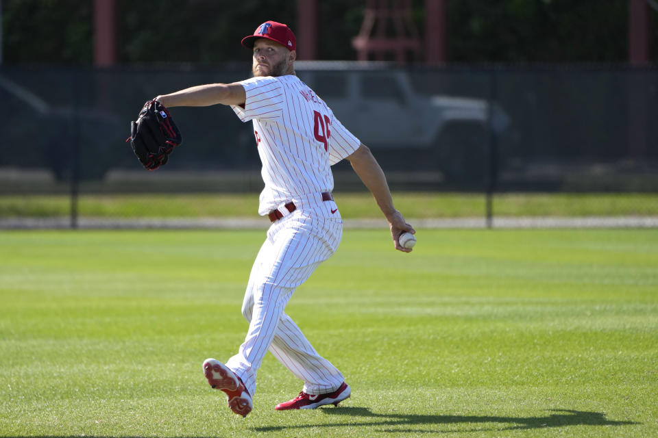 Philadelphia Phillies pitcher Zack Wheeler throws during a baseball spring training workout Wednesday, Feb. 14, 2024, in Clearwater, Fla. (AP Photo/Charlie Neibergall)