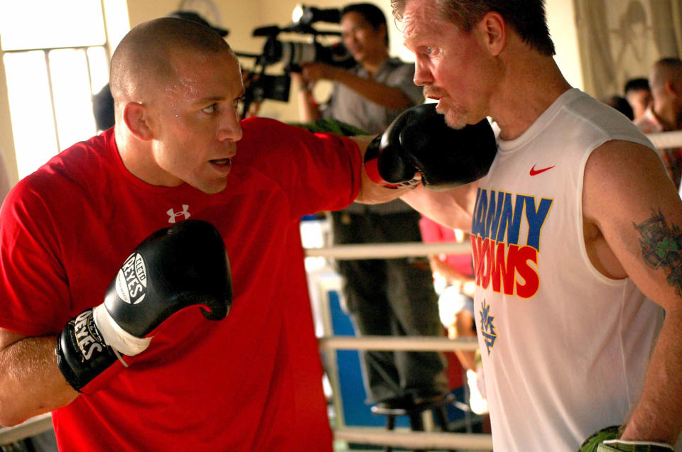 Georges St-Pierre (L) works with Freddie Roach in a training session in 2010. (Getty Images)