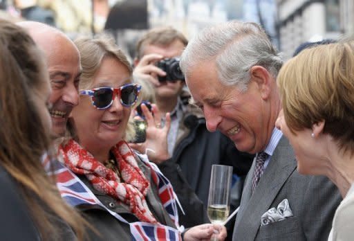 Prince Charles, Prince of Wales (C) laughs as he meets member of the public at the 'Big Jubilee Lunch' street party in Piccadilly in London ahead of the Thames Diamond Jubilee Pageant on June 3