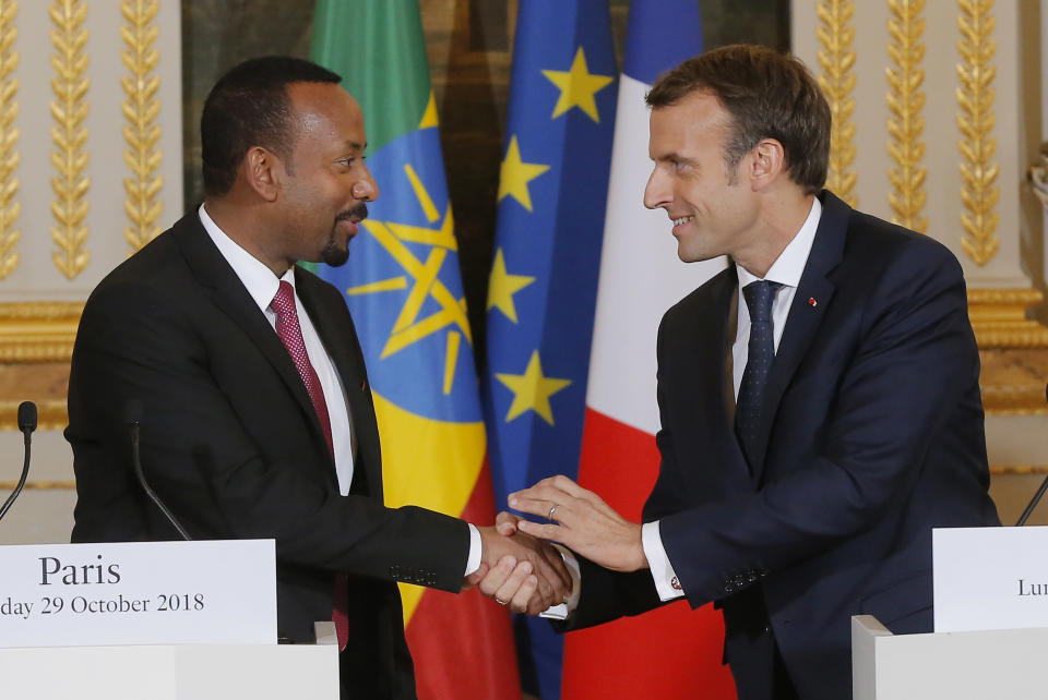 Ethiopian Prime Minister Ably Ahmed, left, and French President Emmanuel Macron shake hands after a media conference at the Elysee Palace in Paris, France, Monday Sept. 29, 2018. Ethiopian Prime Minister Ably Ahmed is in Paris for bilateral talks. (AP Photo/Michel Euler, Pool)