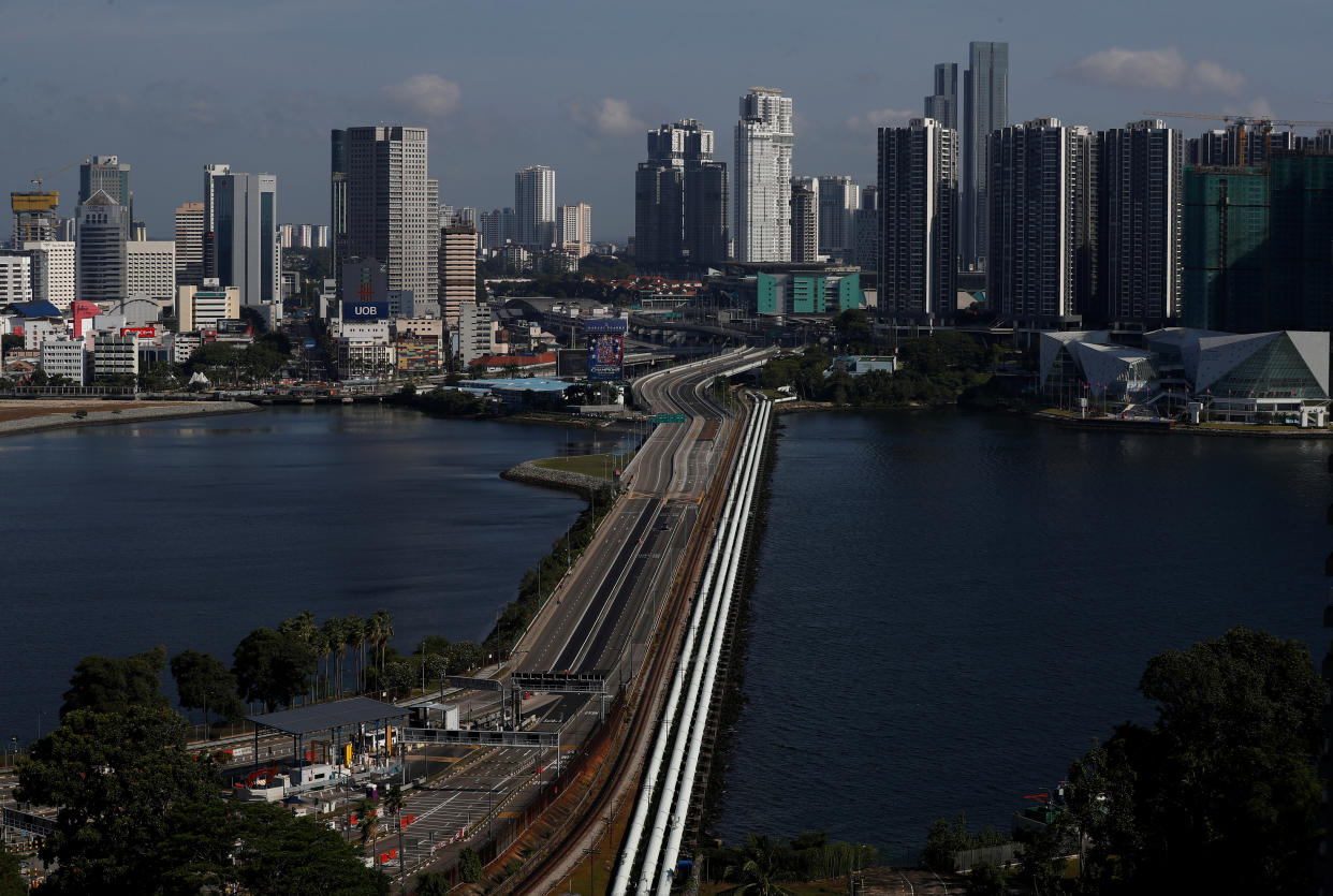 A view of the empty Woodlands Causeway between Singapore and Malaysia after Malaysia imposed a lockdown on travel due to the coronavirus disease (COVID-19) outbreak March 18, 2020.  REUTERS/Edgar Su