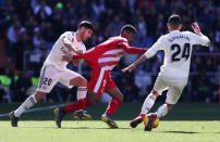 Soccer Football - La Liga Santander - Real Madrid v Girona - Santiago Bernabeu, Madrid, Spain - February 17, 2019 Real Madrid's Marco Asensio and Dani Ceballos in action with Girona's Anthony Lozano REUTERS/Susana Vera