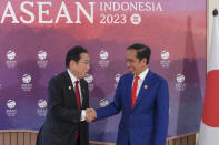 Indonesian President Joko Widodo, right, greets Japan's Prime Minster Fumio Kishida during their bilateral meeting on the sidelines of the Association of Southeast Asian Nations (ASEAN) Summit in Jakarta, Indonesia Thursday, Sept. 7, 2023. (Bay Ismoyo/Pool Photo via AP)