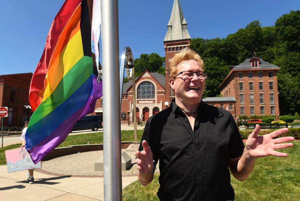 JD Donner, Norwich businessman, talks to a reporter after the Pride Flag raising Tuesday at Norwich City Hall.