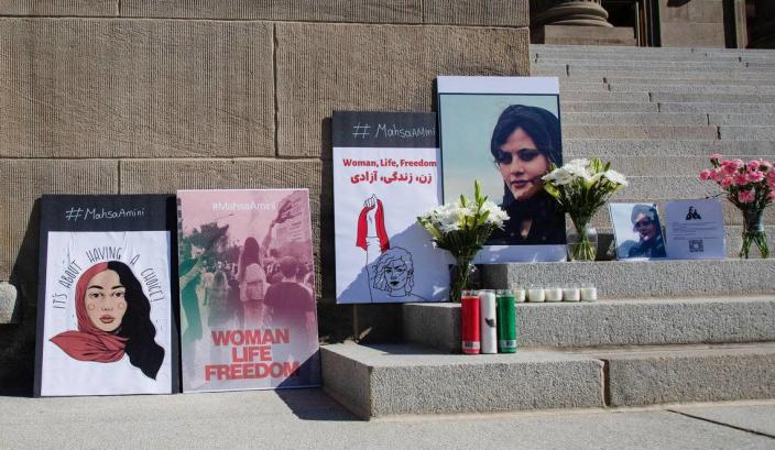 A small memorial for Mahsa Amini, a 22-year-old woman who was taken into custody for allegedly not dressing modestly, is set up on the steps of the Idaho Capitol during a rally held by members of Boise’s Iranian community on Saturday, Oct. 1, 2022.