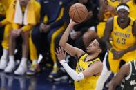 Indiana Pacers' Tyrese Haliburton puts up a shot during the first half of Game 4 of the first round NBA playoff basketball series against the Milwaukee Bucks, Sunday, April 28, 2024, in Indianapolis. (AP Photo/Michael Conroy)