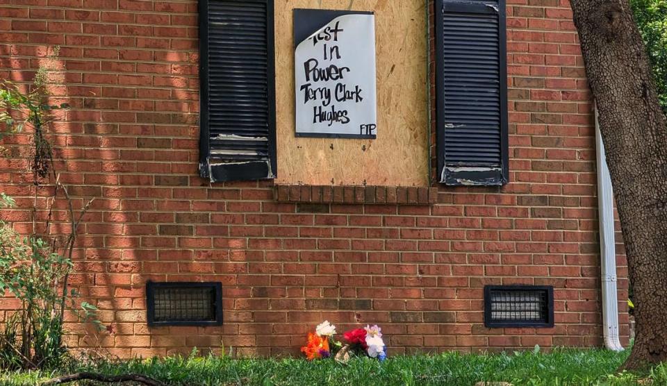 A sign for Terry Clark Hughes Jr. is stapled to the boarded-up house on May 21, 2024, at 5525 Galway Drive in Charlotte. Hughes was killed in a shootout April 29 with U.S. Marshals Task Force serving him a warrant. Four officers were killed and four injured.