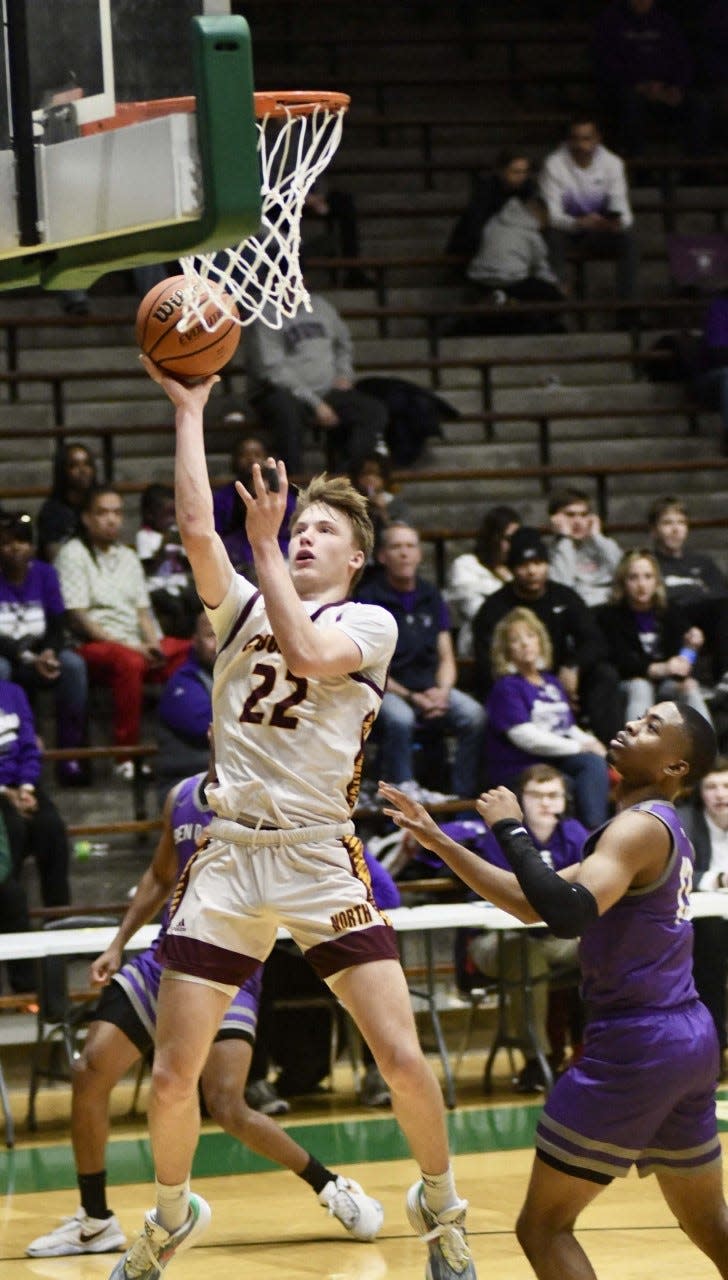 Bloomington North's Luke Lindeman gets loose inside for a layup against Ben Davis in their semifinal game at the New Castle Semistate on Saturday, March 19, 2023.