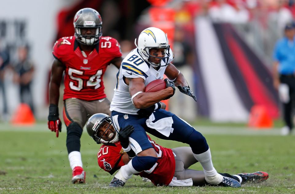 TAMPA, FL - NOVEMBER 11: Safety Ronde Barber #20 of the Tampa Bay Buccaneers tackles receiver Malcom Floyd #80 of the San Diego Chargers during the game at Raymond James Stadium on November 11, 2012 in Tampa, Florida. (Photo by J. Meric/Getty Images)