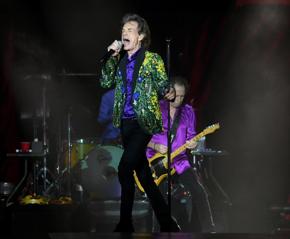 Mick Jagger (L) and Keith Richards of The Rolling Stones perform onstage at Rose Bowl. A small Martian rock has been named in the band's honor.