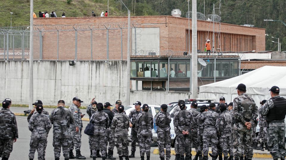 Police outside a prison in Cuenca, Ecuador, where inmates were holding guards hostage on Monday. - Fernando Machado/AFP/Getty Images