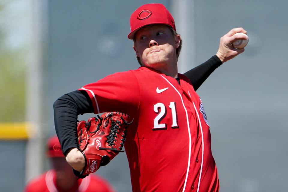 Cincinnati Reds minor league pitcher Andrew Abbott (21) delivers during a spring training game against the Cleveland Guardians, Wednesday, March 23, 2022, at the team's spring training facility in Goodyear, Ariz.