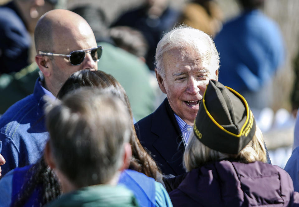 President Joe Biden talks and hugs with Eagle County Veterans Service Officer Pat Hammon before designating the first national monument of his administration at Camp Hale, a World War II era training site, Wednesday, Oct. 12, 2022, near Leadville, Colo. (Chris Dillmann/Vail Daily via AP)