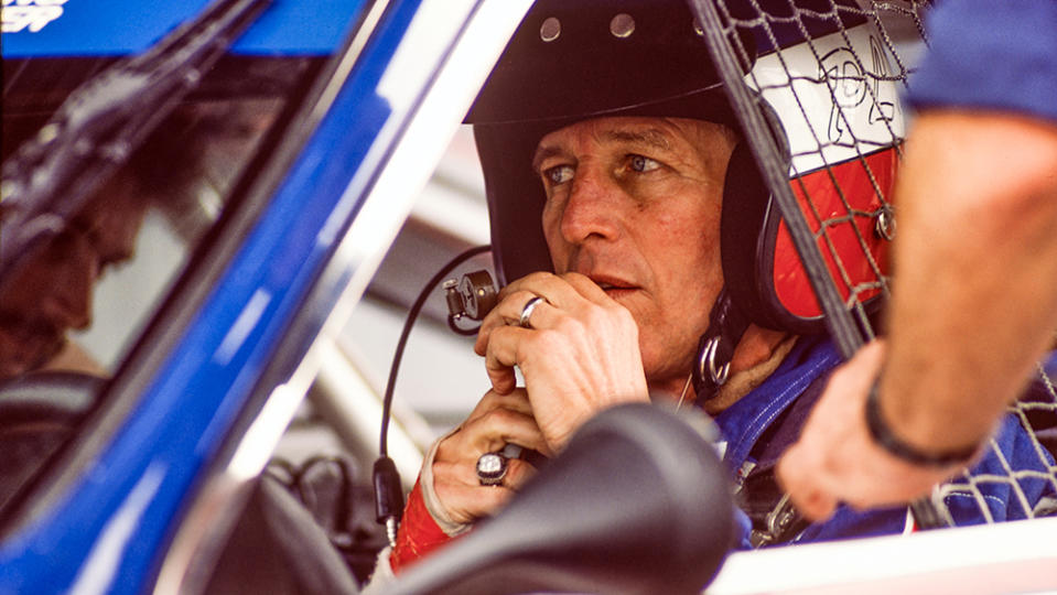 American actor and race car driver Paul Newman in his car during an inspection at Lime Rock Race Track, Lakeville, Connecticut, 1985. (Photo by Brownie Harris/Corbis via Getty Images)