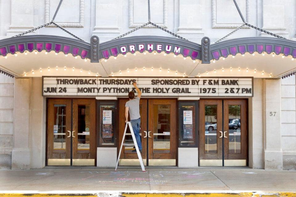 Ross McIntire, technical director of the Orpheum Theatre, also known as the "Jewel of Galesburg," updates the marquee Thursday, June 17, 2021, in downtown Galesburg.