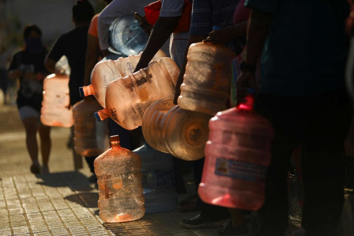 PHOTO: People wait in line to fill water jugs, in the aftermath of Hurricane Otis, in Acapulco, Mexico, Nov. 1, 2023. (Jose Luis Gonzalez/Reuters)