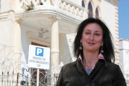 FILE PHOTO - Maltese investigative journalist Daphne Caruana Galizia poses outside the Libyan Embassy in Valletta April 6, 2011. Investigative journalist Caruana Galizia was killed after a powerful bomb blew up a car killing her in Bidnija, Malta, in October 16, 2017. Picture taken April 6, 2011. REUTERS/Darrin Zammit Lupi