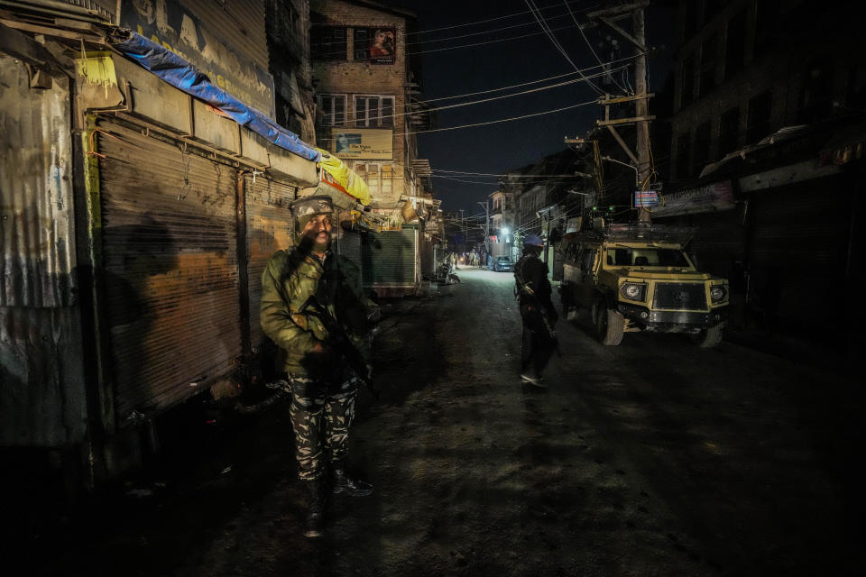 Indian paramilitary soldiers secure the area of shootout in Srinagar, Indian controlled Kashmir, Wednesday, Feb. 7, 2024. Assailants fatally shot a non-local worker and wounded another in the main city of Indian-controlled Kashmir late Wednesday, police said and blamed militants fighting against Indian rule in the disputed region for the attack. (AP Photo/Mukhtar Khan)