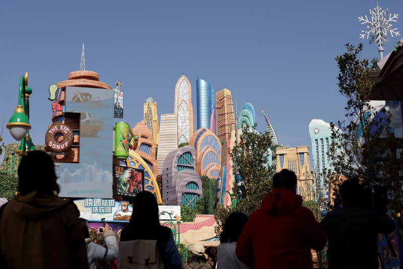 People attend the media preview tour of Disney World's first Zootopia-themed land attraction in Shanghai
