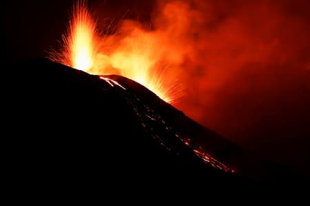 Lava spurts from the Stromboli volcano a day after an eruption unleashed a plume of smoke on the Italian island of Stromboli