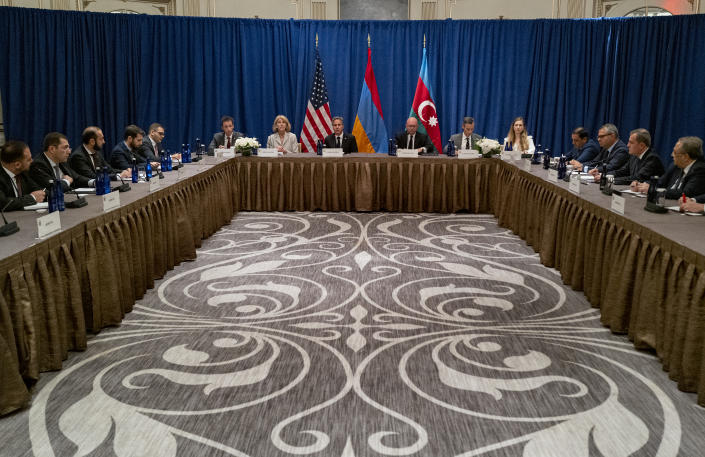 Secretary of State Antony Blinken, center, meets with an Armenian delegation including Foreign Minister Ararat Mirzoyan, left, and a delegation with Azerbaijan including Azerbaijani Foreign Minister Jeyhun Bayramov Monday, Sept. 19, 2022, in New York. (AP Photo/Craig Ruttle, Pool)