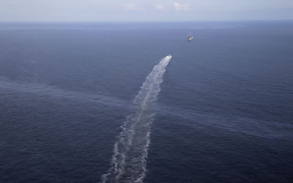 A boat's wake passing through a Taylor Energy oil sheen in 2015.