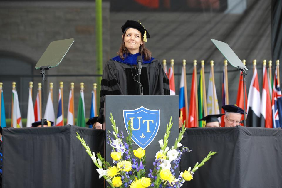 The <em>Dawson's Creek</em> actress returned to her hometown of Toledo, Ohio, to <a rel="nofollow noopener" href="https://people.com/movies/katie-holmes-returns-hometown-to-deliver-commencement-speech/" target="_blank" data-ylk="slk:deliver the commencement speech;elm:context_link;itc:0;sec:content-canvas" class="link ">deliver the commencement speech</a> to more than 2,000 undergraduate students at the University of Toledo's Glass Bowl Stadium on May 18. The mother of one gave some cheeky advice on the importance of being yourself — literally. "Another thing I learned, don’t use a fake ID to buy wine and then try to pay with a check. I’m aware that no one pays by check these days, but that’s just more reason not to do it. That’ll be extra confusing," she said. She had a particularly potent message for the female graduates: "For the young women in the audience, I want to encourage you to lift up, listen to, and trust one another ... Especially now, women supporting women could not be more important." She closed with a powerful reminder that there's no time like the present to work for what you want and enjoy what you already have. "So if you’re waiting for a sign, this is it. … You are the person who’s going to go out there and make things happen for yourself. And that’s a terrifying and amazing responsibility. You deserve joy — not in ten years, but now. So try to be equal parts tough and gentle with yourself. Take things one step at a time. Work hard when no one is looking. And don’t let anybody say you never called them back."