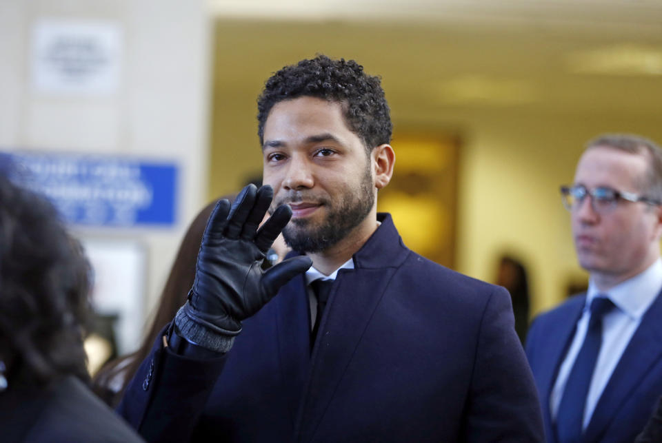 Jussie Smollett waves after his court appearance at Leighton Courthouse in Chicago on Tuesday. (Photo by Nuccio DiNuzzo/Getty Images)