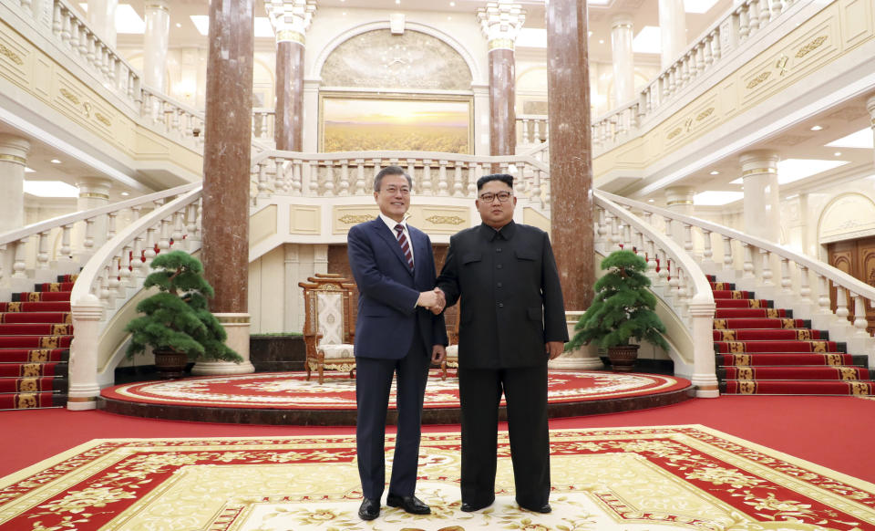 In this Sept. 18, 2018, file photo, South Korean President Moon Jae-in, left, and North Koran leader Kim Jong Un stand at the headquarters of the Central Committee of the Workers' Party in Pyongyang, North Korea. (Pyongyang Press Corps Pool via AP, File)