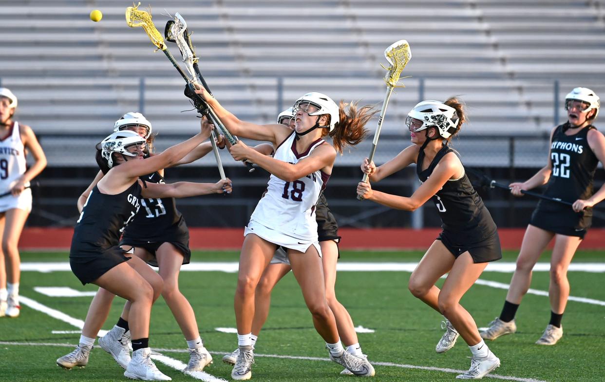 Riverview Rams' Susan Lowther (18) misses a shot as Sickles Gryphons's girls close in for some intense defense during a playoff game at the Ram Bowl in Sarasota on Friday, April, 22, 2022.