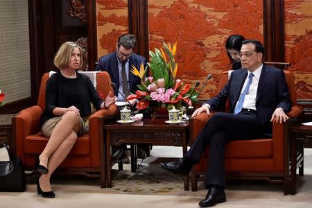 Chinese Premier Li Keqiang speaks with the European Union's foreign policy chief, Federica Mogherini during their meeting at the Zhongnanhai leadership compound in Beijing, China, April 18, 2017. REUTERS/Kenzaburo Fukuhara/Pool