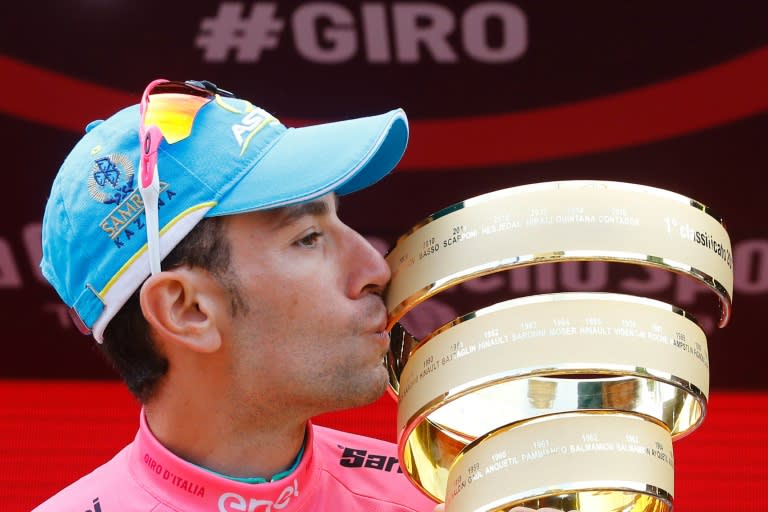 Italy's Vincenzo Nibali kisses the trophy on the podium after winning the 99th Giro d'Italia, Tour of Italy