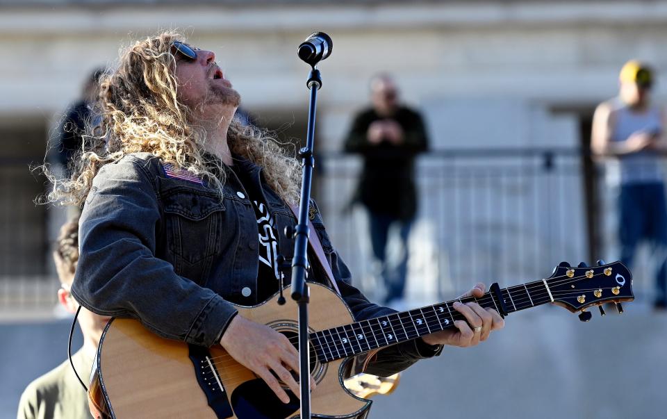 Sean Feucht performs during the Day of Prayer at the War Memorial Plaza on Saturday.