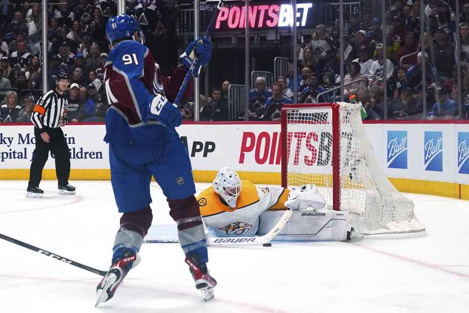 Nashville Predators goaltender Connor Ingram (39) makes a save against Colorado Avalanche center Nazem Kadri (91) during the third period of Game 2 of an NHL hockey Stanley Cup first-round playoff series Thursday, May 5, 2022, in Denver. The Avalanche won 2-1. (AP Photo/Jack Dempsey)