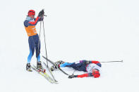 <div>ASSISTANCE - Natalia Yakimova stops to help as Elena Remizova of Russia lies on the ground after winning silver in the women's 1km sprint, visually impaired cross-country.</div>