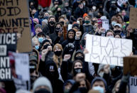 A crowd gathers at the Brooklyn Center Police Department in Brooklyn Center, Minn., Monday, April 12, 2021, for a No Justice No Peace rally following the police shooting death of Daunte Wright. (Carlos Gonzalez/Star Tribune via AP)