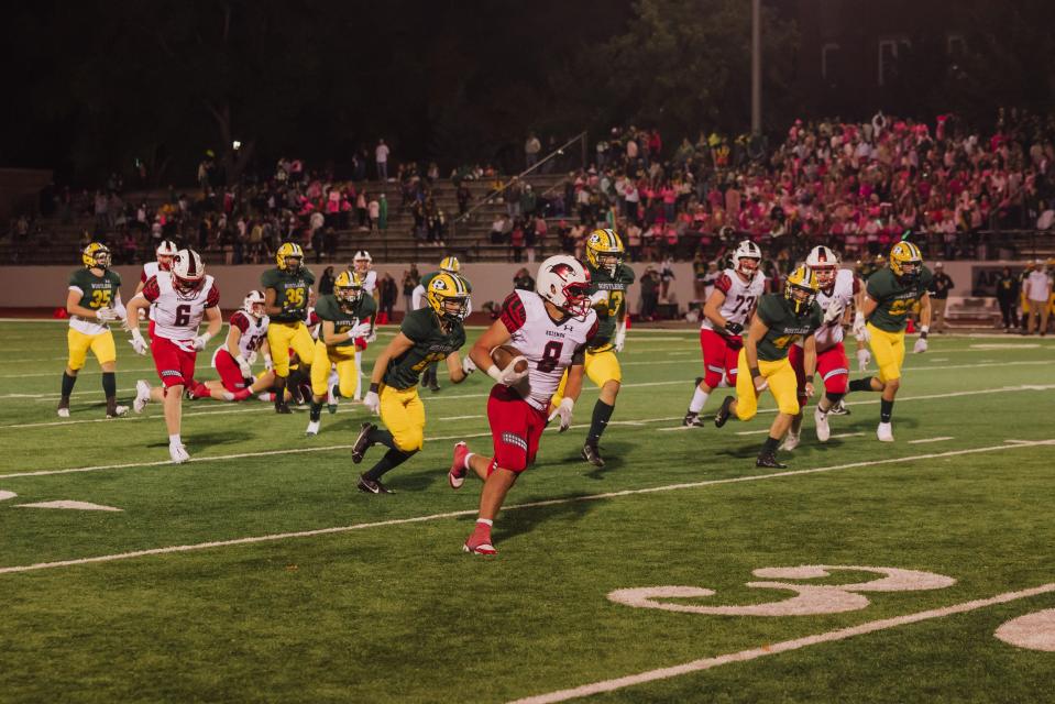 Bozeman High's Brady Casagranda rushes for a touchdown against C.M. Russell High Friday at Memorial Stadium.