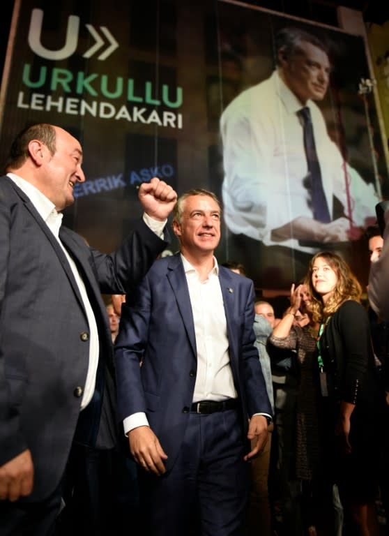 Current Basque regional president and Basque Nationalist Party candidate Inigo Urkullu (R) and president of PNV Andoni Ortuzar celebrate outside the PNV headquarters in Bilbao, after winning the Basque regional elections on September 25, 2016