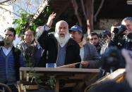 A Turkish man speaks to a crowd about doomsday in Sirince, a village in western Turkey, on December 21, 2012. As the village of Sirince waited for what some say is an apocalypse from which the tiny Turkish hamlet will be spared, its streets were teeming not with doomsayers but a hoard of disappointed journalists