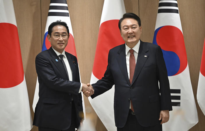 FILE - South Korean President Yoon Suk Yeol, right, shakes hands with Japanese Prime Minister Fumio Kishida during their meeting at the presidential office in Seoul Sunday, on May 7, 2023. Yoon held back-to-back summits with Kishida in recent weeks that showed their willingness to overcome historical grievances that strained bilateral ties for years and strengthen cooperation in the face of shared challenges, including a nuclear North Korea and China’s regional assertiveness. (Jung Yeon-je/Pool Photo via AP, File)
