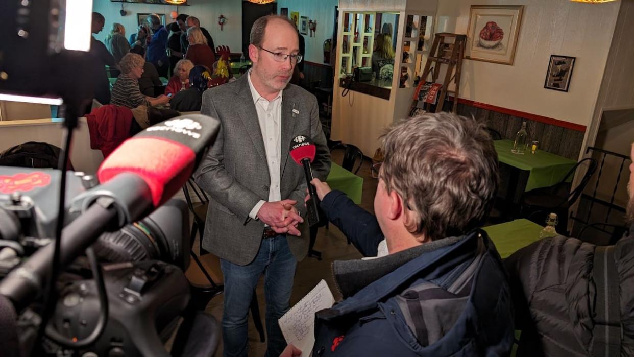 Green Party candidate Matt MacFarlane, shown speaking to reporters Wednesday night, will be the new MLA for District 19.  (Ken Linton/CBC - image credit)