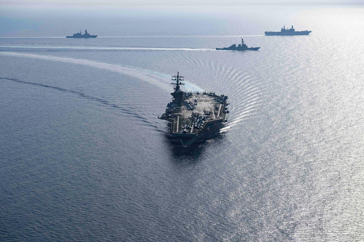 Components of the Dwight D. Eisenhower Carrier Group steam in formation with the Italian navy in the Red Sea on June 7.