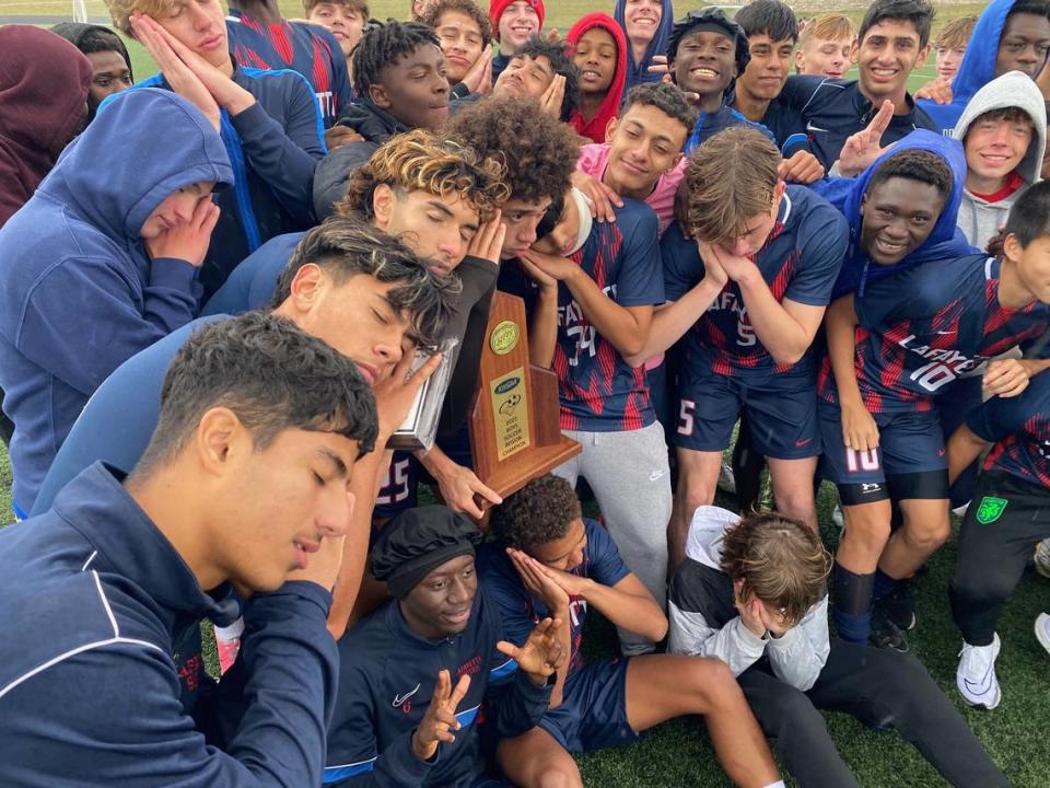 The Lafayette Generals playfully pretended to be asleep after claiming the 11th Region boys soccer tournament championship on Oct. 14 at Great Crossing High School in Georgetown. Coaches said the team felt overlooked (i.e. slept on) by the media going into the postseason.