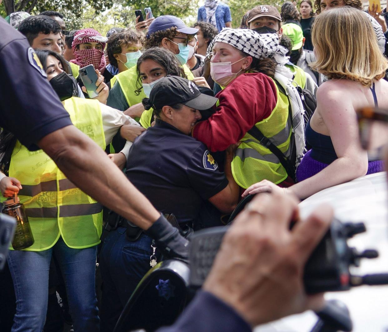 Protesters scuffle with security officers at the University of Southern California in Los Angeles on April 24, 2024.