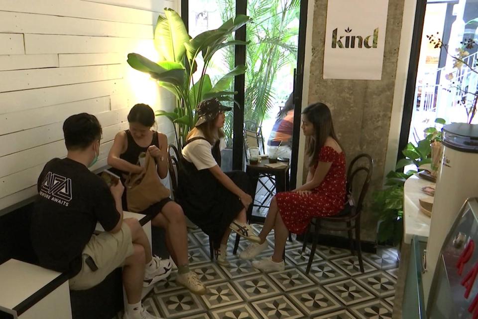 Customers sit at tables in Hong Kong's first CBD cafe (AP)