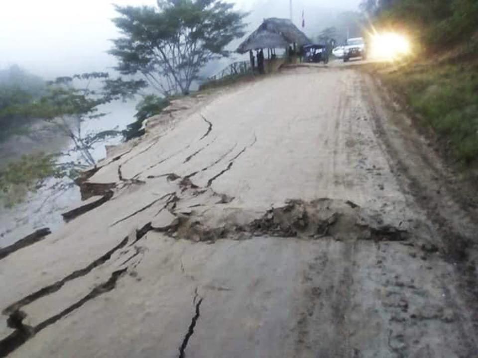 In this photo courtesy of Hoy Noticias media, cracks caused by an earthquake affect a road in San Martin, Peru, Sunday, May 26, 2019. A powerful magnitude 8.0 earthquake struck a remote part of the Amazon jungle in Peru early Sunday, collapsing buildings and knocking out power to some areas. (Hoy Noticias via AP)