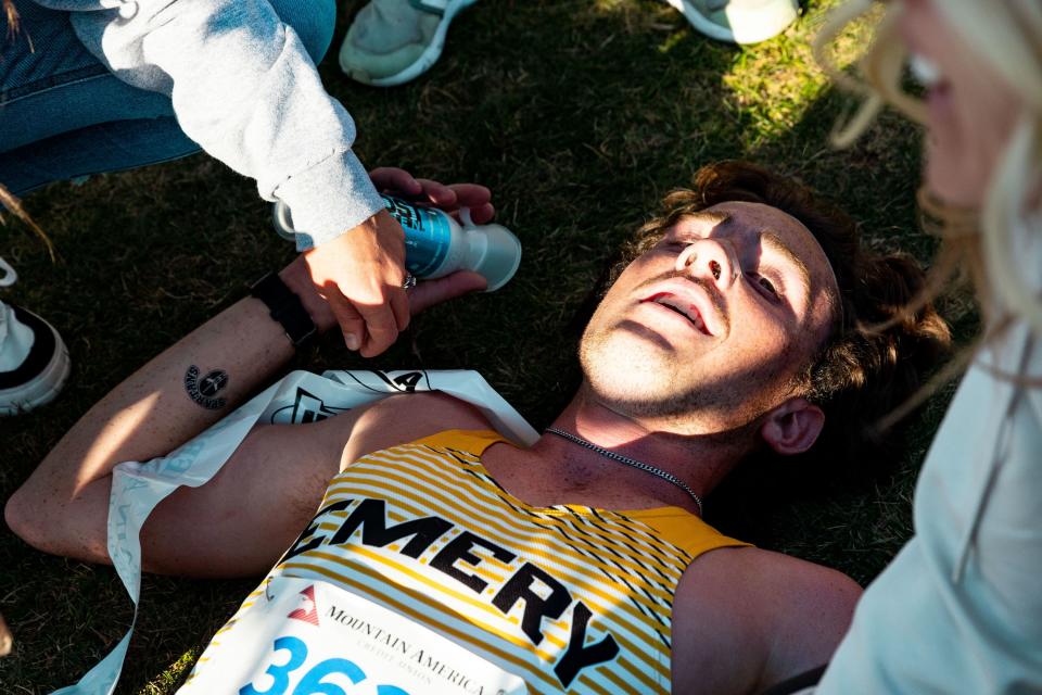 Emery High School’s Camdon Larsen lays on the ground after finishing first place in the 3A boys state high school cross-country championships at the Regional Athletic Complex in Salt Lake City on Tuesday, Oct. 24, 2023. | Megan Nielsen, Deseret News